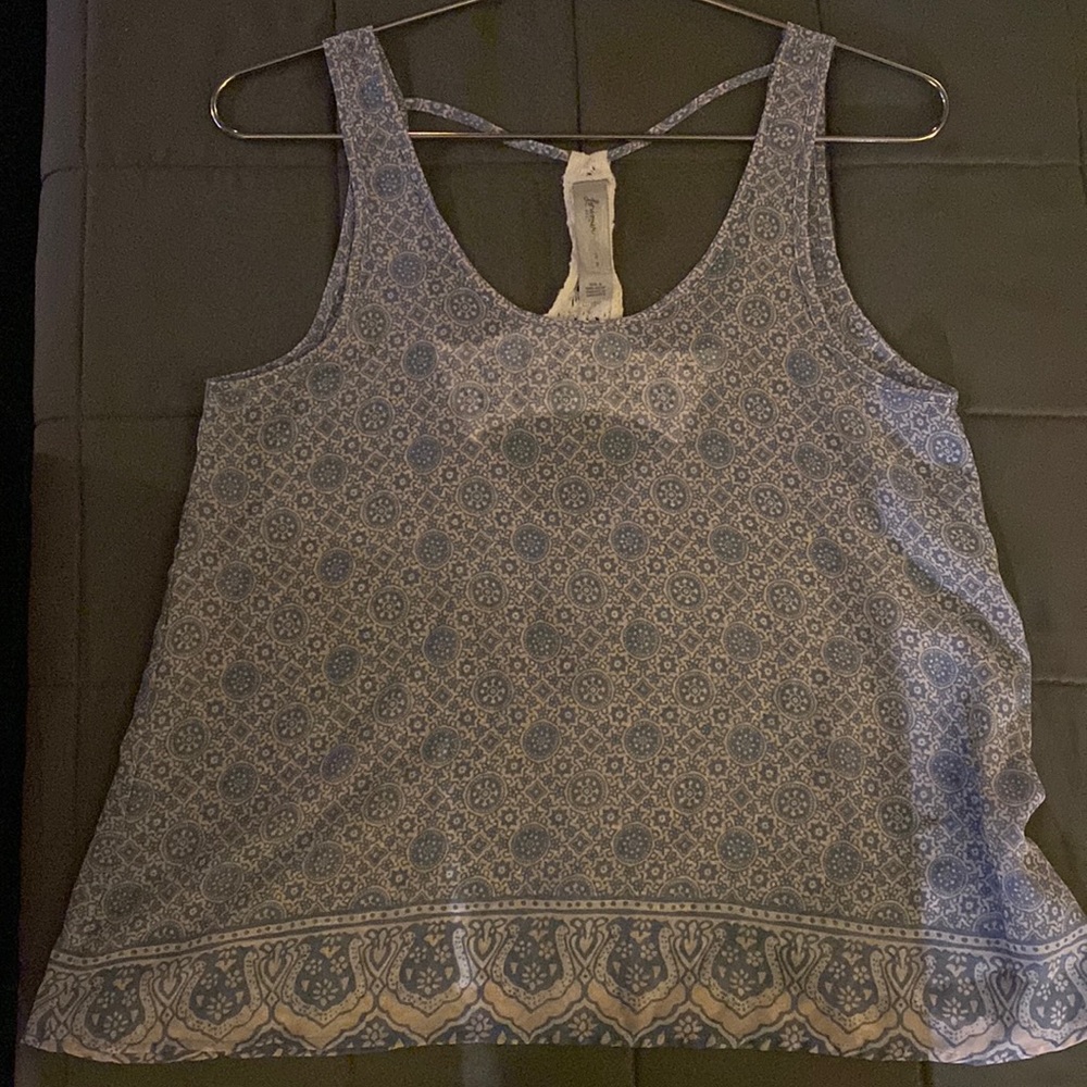 Flowy tank somewhat see through.